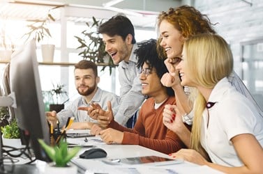young team looking at computer screen in office to 2021 08 26 16 32 28 utc